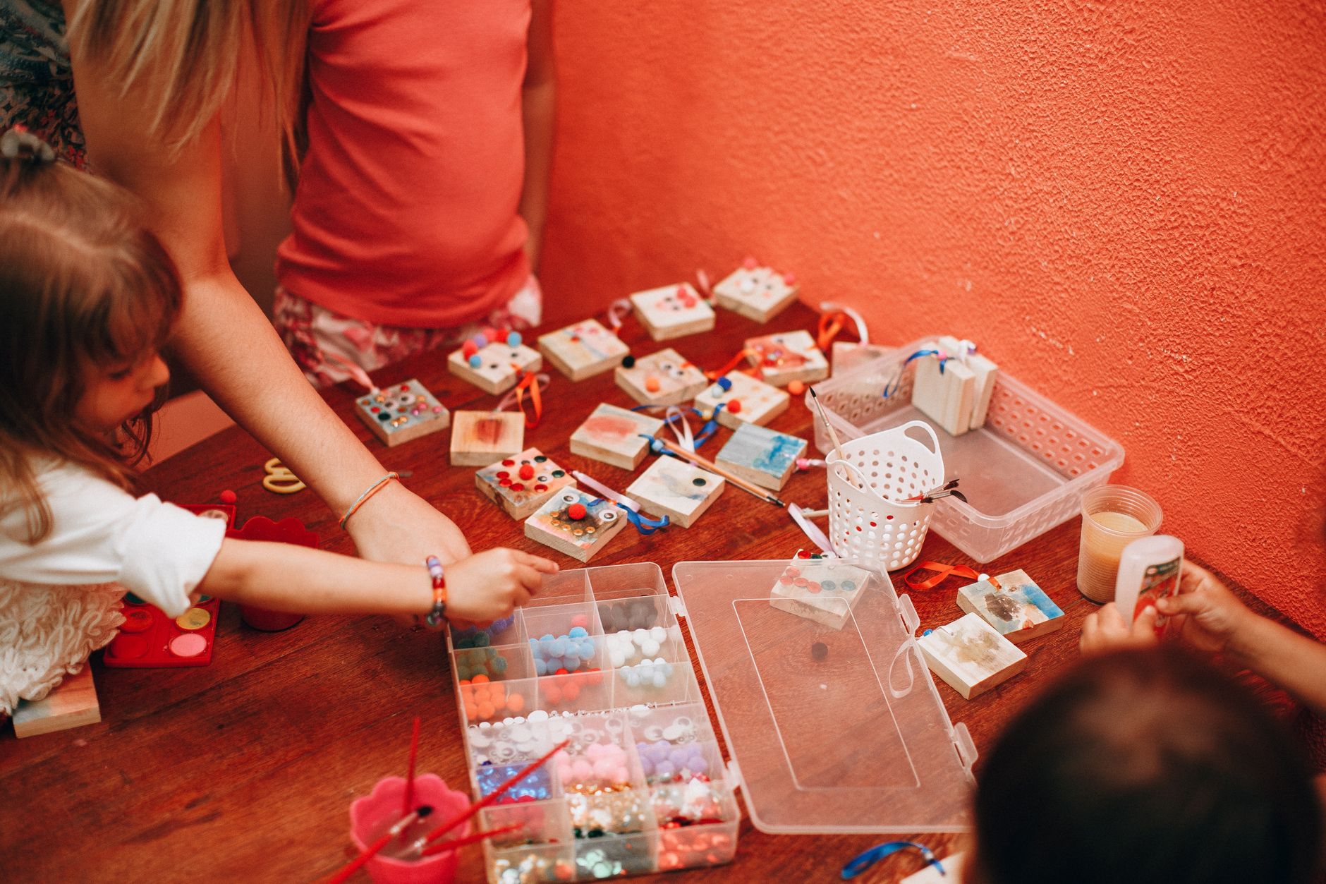 Plate 13. A tray of tiny boxes, beads and brushes that children sort and arrange by hand.